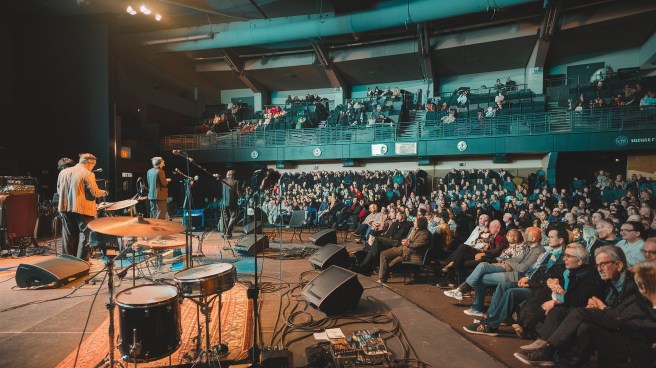 a-photo-of-a-concert-venue-with-a-stage-_qFD7uCDNRsSX1JT5ToPAIA_muJyHQRsQgS834FlhcUBAg